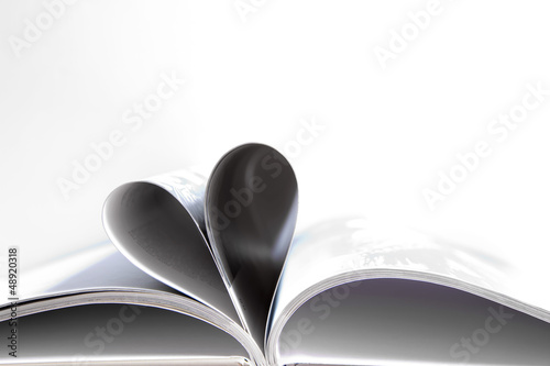 Photo: Pages of a book curved into a heart shape Pages of a book curved into a heart shape