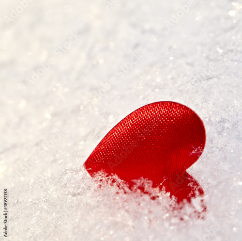Photo: Red heart on snow Red heart on snow
