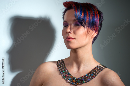 Photo: portrait of a beautiful girl with dyed hair, professional hair c portrait of a beautiful girl with dyed hair, professional hair c