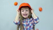 Orange rain. At the head of child falling tangerines.