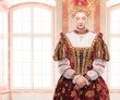 Her royal highness standing against window