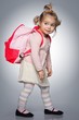 Foto: Funny little girl with backpack Funny little girl with backpack