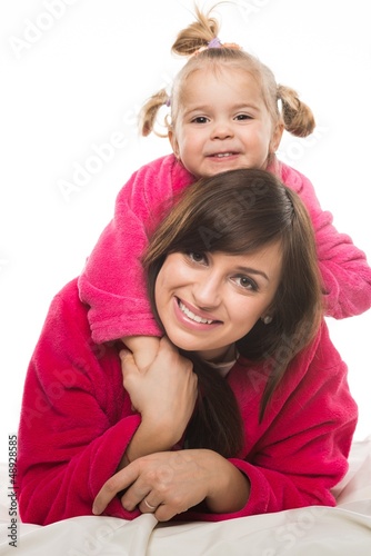 Photo: Happy mother and daughter in dressing gowns Happy mother and daughter in dressing gowns