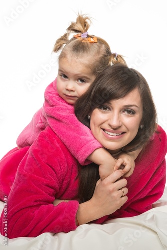 Photo: Happy mother and daughter in dressing gowns Happy mother and daughter in dressing gowns