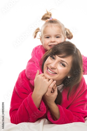 Photo: Happy mother and daughter in dressing gowns Happy mother and daughter in dressing gowns