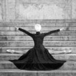 Young beautiful ballerina with black long dress posing on Pincio