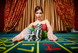 Photo: Woman wins roulette and takes away piles of chips Woman wins roulette and takes away piles of chips