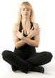 Pretty  blond woman doing yoga stretching exercise