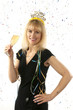 Woman celebrating with a glass of champagne on New Year's Eve