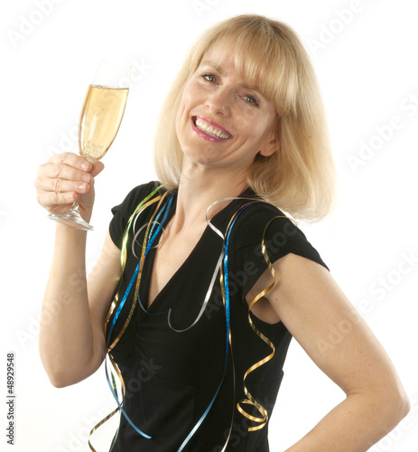 Photo: Woman celebrating with a glass of champagne Woman celebrating with a glass of champagne