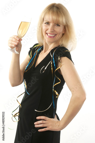 Photo: Woman celebrating with a glass of champagne Woman celebrating with a glass of champagne