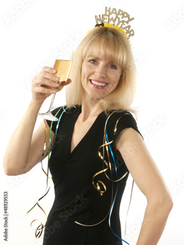 Photo: Woman celebrating with champagne New Year's Eve Woman celebrating with champagne New Year's Eve