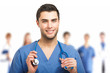 Handsome doctor in front of his team