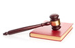 Judge's gavel on red legal book