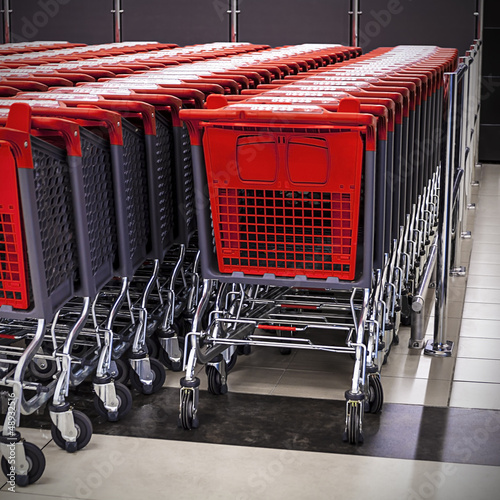 Photo: rows of shopping carts in the store rows of shopping carts in the store