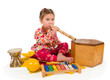 One small little girl playing music.