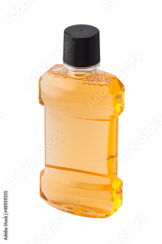 Photo: Bottle of mint orange mouthwash isolated on white backgr Bottle of mint orange mouthwash isolated on white backgr