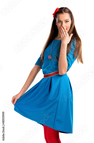 Photo: Cute young woman in blue dress on white background Cute young woman in blue dress on white background