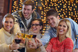 Photo: Group of happy young people drink wine at party Group of happy young people drink wine at party