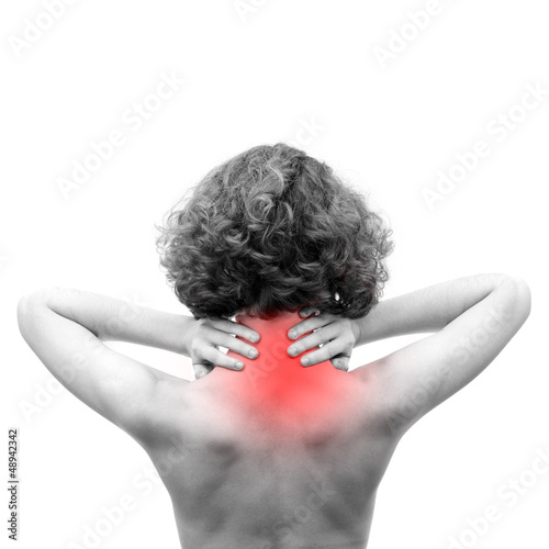 Photo: Femme se tenant le dos à cause de la douleur Femme se tenant le dos à cause de la douleur