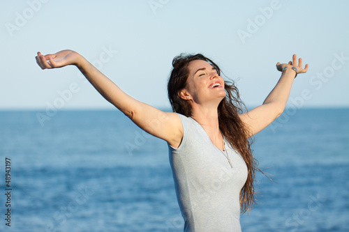 Photo: Beautiful woman with arms outstretched Beautiful woman with arms outstretched