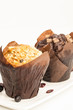 Chocolate  and blueberry muffin on white  with space for text