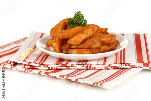 Photo: Appetizing village potatoes on plate isolated on white Appetizing village potatoes on plate isolated on white