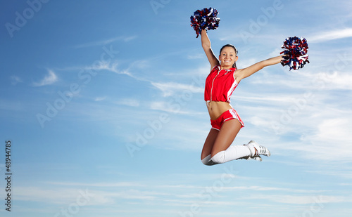 Photo: Young female cheerleader Young female cheerleader