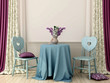 Table with two blue chairs