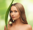 woman with green leaf