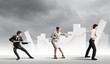 Three business people pulling rope