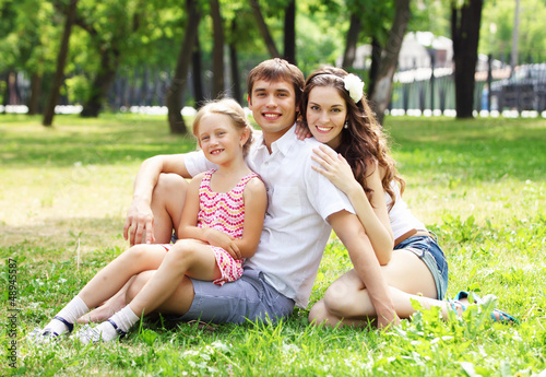 Photo: happy family having fun outdoors happy family having fun outdoors