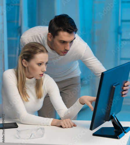 Photo: man and woman in laboratory man and woman in laboratory