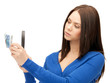 woman with magnifying glass and euro cash money