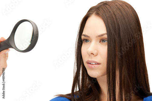 Photo: woman with magnifying glass woman with magnifying glass