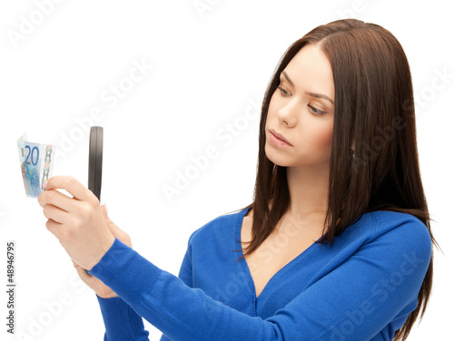 Photo: woman with magnifying glass and euro cash money woman with magnifying glass and euro cash money