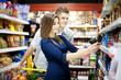Young couple shopping at supermarket