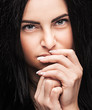 young brunette looking thoughtfully