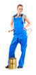 Young woman in blue overalls with painting tools
