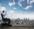 Photo: Businessman with binoculars. Businessman with binoculars.