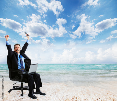 Photo: Businessman with laptop computer. Businessman with laptop computer.