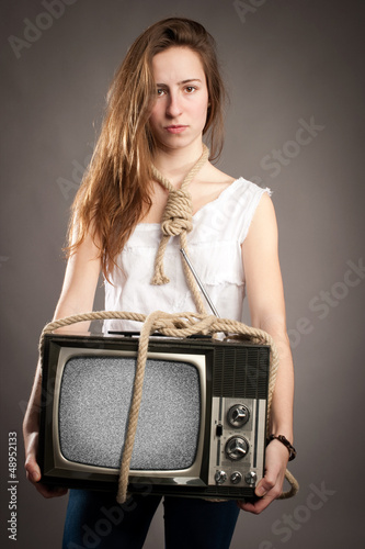 Photo: girl holding retro television girl holding retro television