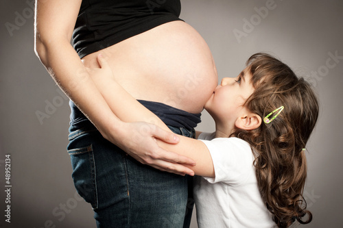 Photo: kissing her pregnant mother kissing her pregnant mother