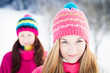 Two young girl friends in winter outdoors. Holidays. Happy Teens