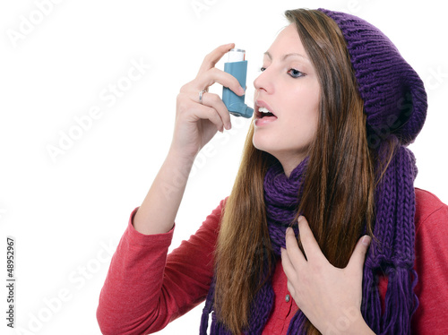 Photo: Woman with asthma using an asthma inhaler Woman with asthma using an asthma inhaler