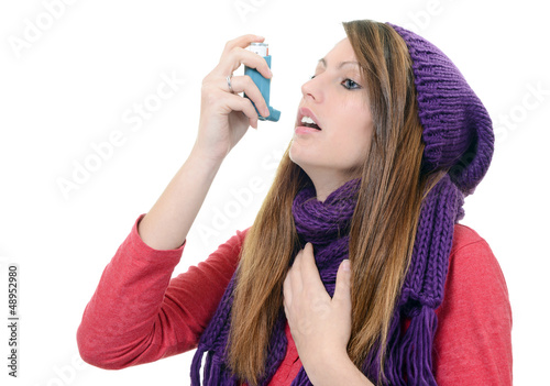 Photo: Woman with asthma using an asthma inhaler Woman with asthma using an asthma inhaler