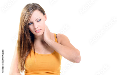 Photo: Beautifull woman holding her neck because of pain isolated Beautifull woman holding her neck because of pain isolated