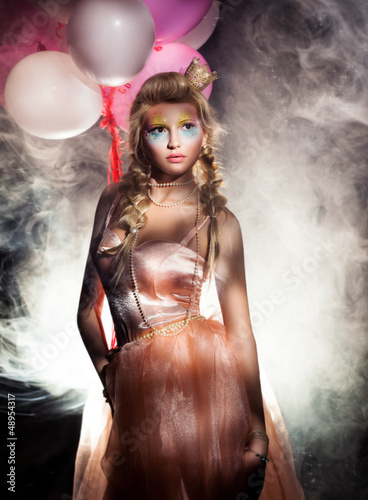 Photo: Beautiful Princess in Pink Dress with Golden Crown. Haze Beautiful Princess in Pink Dress with Golden Crown. Haze