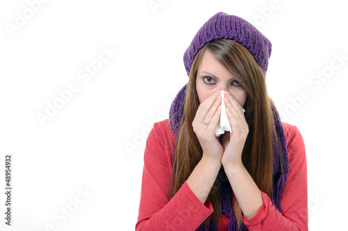 Photo: Woman sneezing into handkerchief. Virus.Medicines Woman sneezing into handkerchief. Virus.Medicines