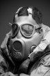 Photo: Man in protective mask on gray background Man in protective mask on gray background